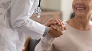 female with doctor celebrating a successful treatment for cervical radiculopathy